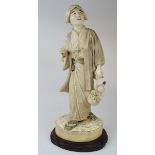 A Japanese carved ivory figure, of a man