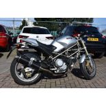 A 1994 Ducati M900 Monster, registration number L551 RYB, silver.