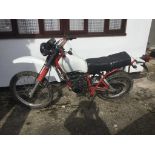 A 1984 Yamaha XT125 project, registration number A689 PTA, white.