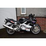 A 2000 Honda CBR600F, registration number W357 TDV, West racing colours.