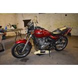 A 1993 Kawasaki ***550 (not 750)*** Zephyr, registration number K594 XCW, red.