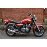 A 1992 Kawasaki ZR750 Zephyr, registration number J95 UUK, red.