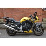 A 2003 Yamaha FZS1000 Fazer, registration number WA03 MWX, yellow.