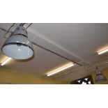 A pair of grey enamel industrial ceiling hanging lamps,