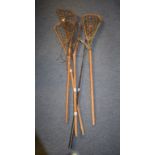 Four lacrosse sticks,