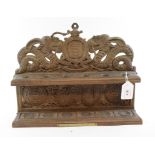 A Kashmiri carved pipe stand, bears a presentation plaque,