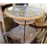 A 1950's Franco Albini style rattan table, with a glass top, on a metal frame, 69.