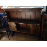 An inlaid oak and pine plate rack,