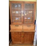 A Victorian mahogany wardrobe, 122 cm wide, and an oak bookcase on cupboard,