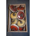 Assorted indoor curling stones, and a wicker picnic basket,