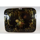 A late Victorian papier mache rectangular tray, painted basket flowers and with gilt decoration,