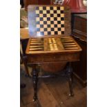 A Victorian games/work table, veneered in burr walnut, the fold over top inlaid for chess,