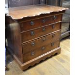 An early 19th century Dutch oak chest, the shaped top above four long drawers, on bracket feet,