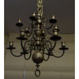 An 18th century style brass twelve light hanging lamp,