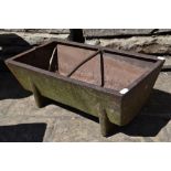 An iron pig trough,