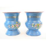 A group of six blue enamel vases, decorated flowers and insects,