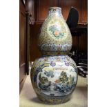 A large Chinese double gourd vase, decorated landscapes, flowers and animals,