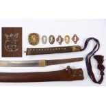 A Japanese katana, the 67 cm blade signed, with a pierced brass tsuba,