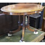 A Victorian oval rosewood centre table, inlaid a band of scrolling foliage,