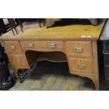 A late Victorian satin walnut kneehole table, having five drawers,