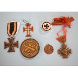 A German WWI Iron Cross, two RMS Lusitania medallions, boxed,