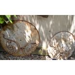 A pair of vintage painted metal garden tables, with a pierced design,