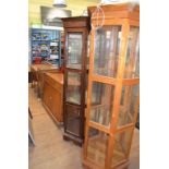 An oak gramophone cabinet, 42 cm wide, an oak hall table, two display cabinets,