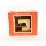 A Little Betty miniature sewing machine, a Kay Chemistry Set, other toys, coins,