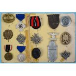 A group of German Third Reich badges, collected as a 'souvenier', including U Boat, Narvik shield,