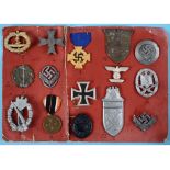 A group of German Third Reich badges, collected as a 'souvenier', including U Boat, Narvik shield,