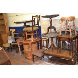 A 19th century oak tripod table, 81 cm diameter, two other tripod tables,