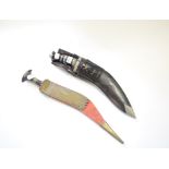 A kukri, in a leather scabbard,