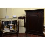 An oval mahogany kettle stand, 37 cm wide, an oak hanging corner cupboard,