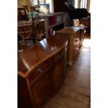 A George III style inlaid mahogany serpentine front sideboard, 153 cm wide, a pine cupboard,