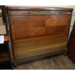 A French inlaid bed end, with brass mounts,