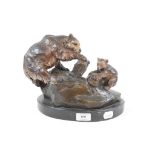 A bronze group, of two bears on a rock,