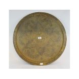 An Islamic inlaid brass tray, 60 cm diam