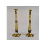 A pair of table candlesticks, the carved