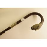 A carved Victorian crook bamboo cane, wi