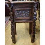 An oak bedside cupboard, with a panel do