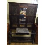A late Victorian oak hallstand, carved f