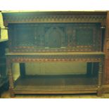 An inlaid oak buffet, with carved decora