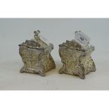 A pair of rococo style silver plated tea