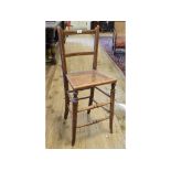 An Edwardian beech deportment chair