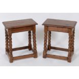 A pair of joined fruitwood stools, on bo