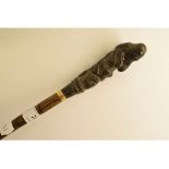 An erotic walking cane, the carved horn