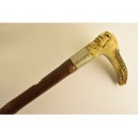 A carved stag antler L shaped handled wa