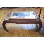 A Chinese carved low table, 99 cm wide,