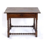 An 18th century oak table, with a frieze