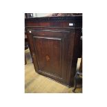 An oak hanging corner cupboard, the pane